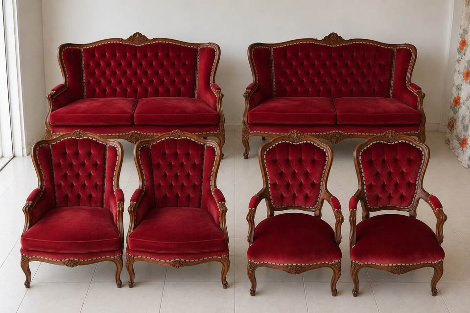 Catalogue photograph of the complete six-piece Crimson Salon: two settees, two high-back wing armchairs and two smaller carved armchairs.