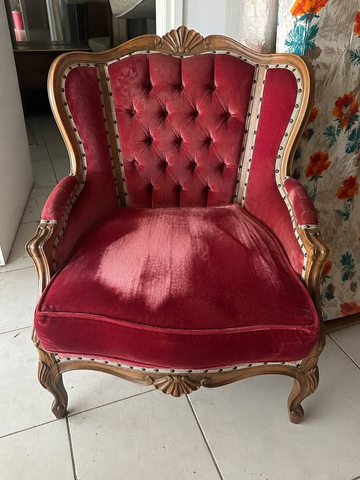 Catalogue photograph of a Crimson Salon high-back wing armchair available for hire.