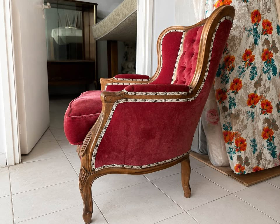 Catalogue side photograph of a Crimson Salon high-back wing armchair.